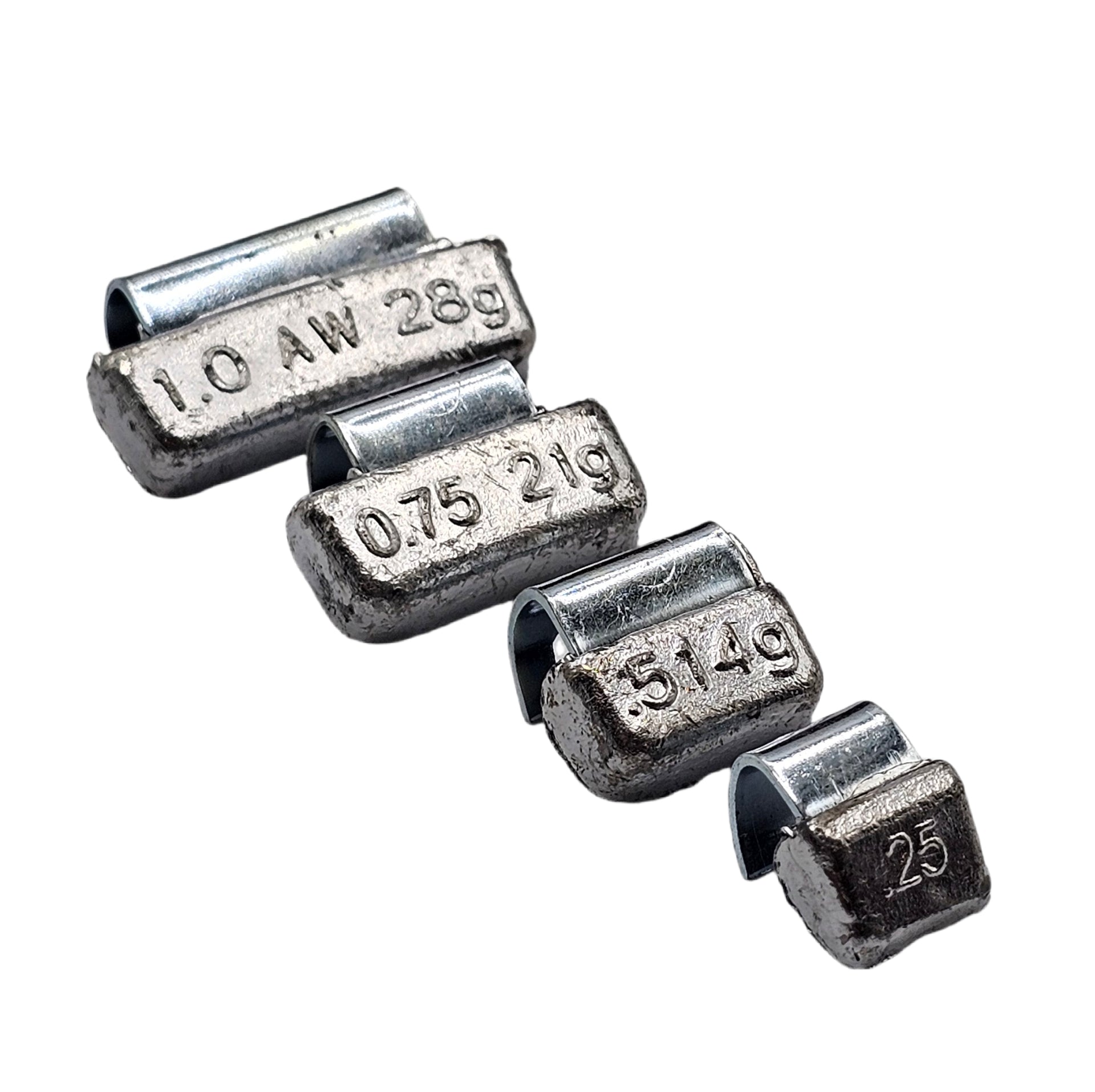 Set of metal weights with engraved measurements on a white background