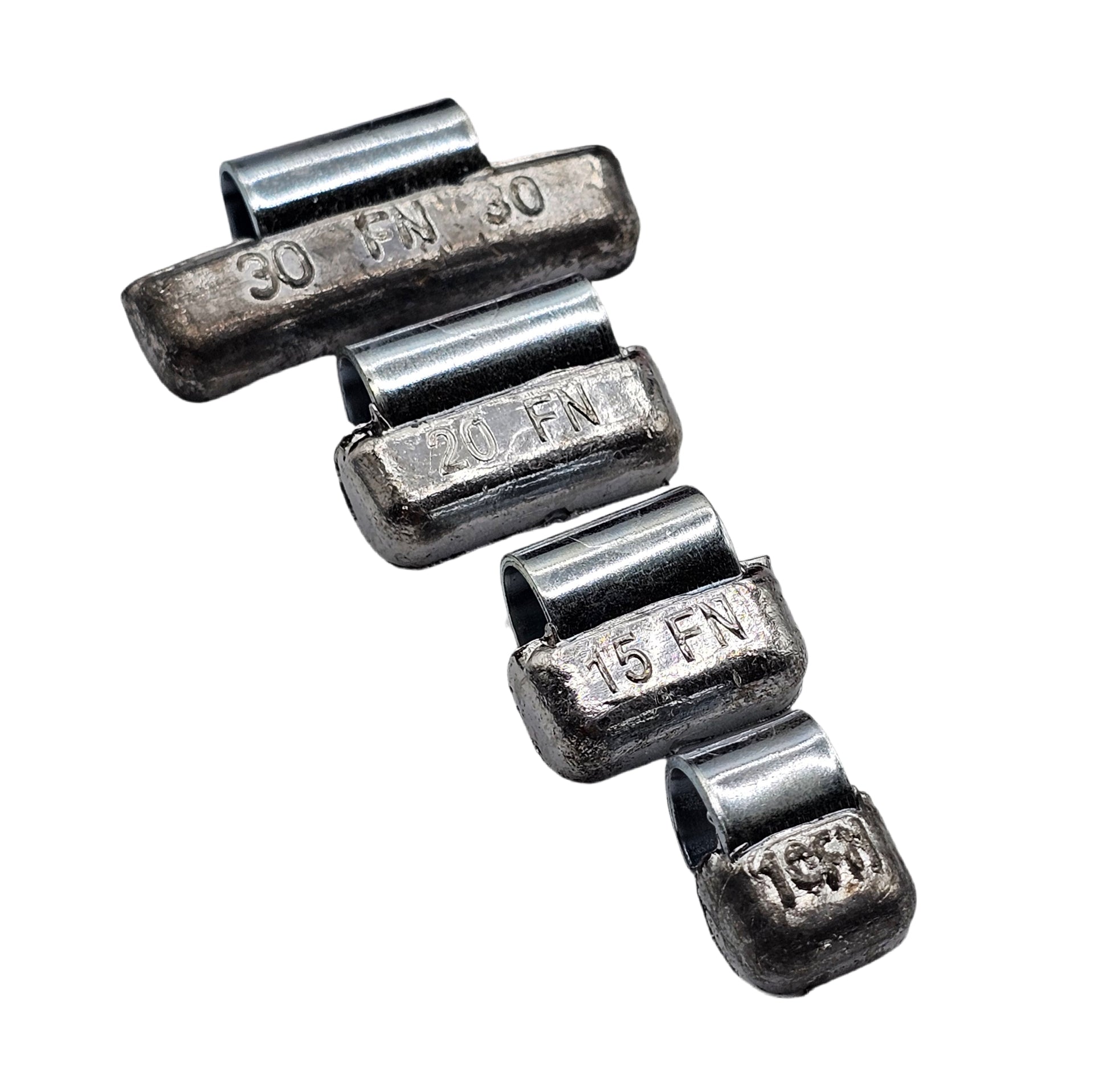 Set of metal weights with engraved measurements on a white background