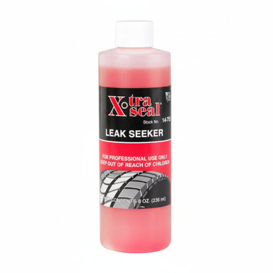 Pink bottle of Xtra seal Leak Seeker with black and red label on a white background