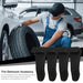 Person changing a tire with a tire demount accessory in the foreground