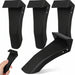 Set of black metal brackets on a white background