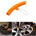 Orange tire iron with use examples on a white background