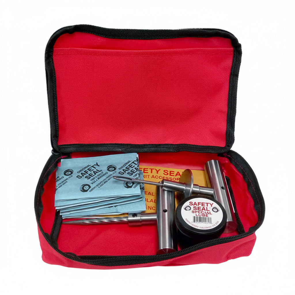 Open red first aid kit with medical supplies on a white background